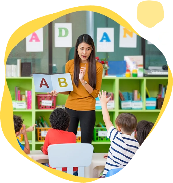 A woman is teaching children in an organized classroom.