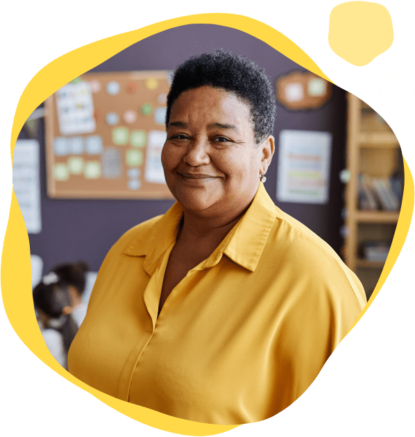 A woman in yellow shirt smiling for the camera.